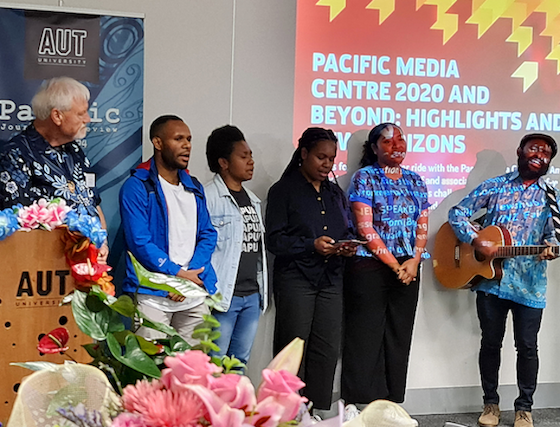 Departing Professor David Robie with singing West Papuan students at the final PMC public seminar in December 2020