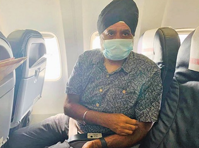 Professor Pal Ahluwalia on his deportation flight in 2021