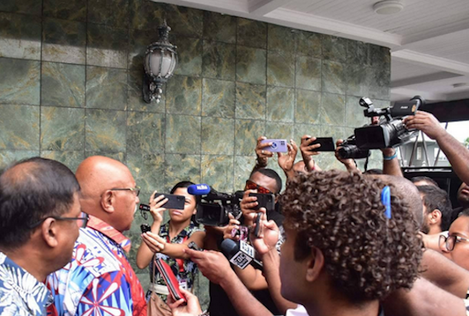 Fiji Prime Minister Sitiveni Rabuka (second from left) and Deputy PM Professor Biman Prasad (left) talk to the media in Suva after their meeting with the Sodelpa management before winning the prime ministership vote