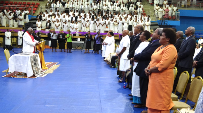 The Methodist Church's Reverend Ili Vunisuwai praying