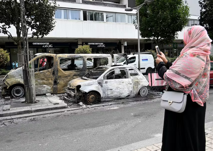 Burnt-out cars in the Northern suburbs of Paris, Sarcelles