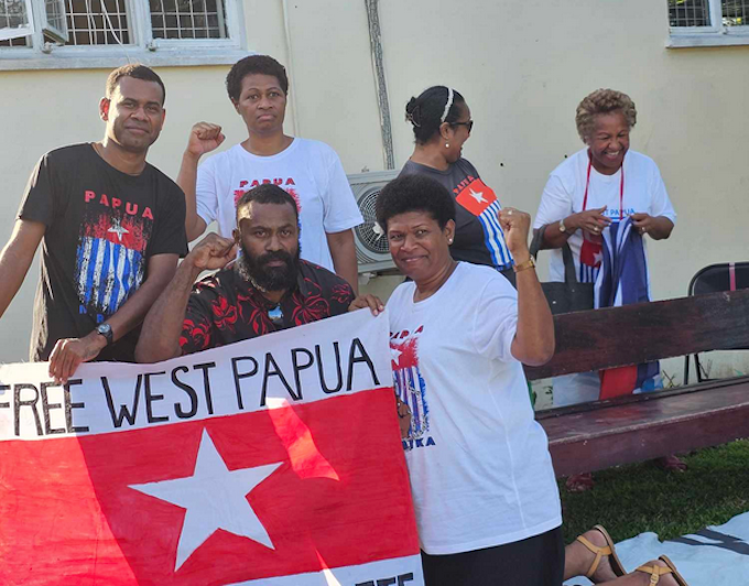 Piango Pacific activists in Fiji raise the Morning Star flag of West Papua