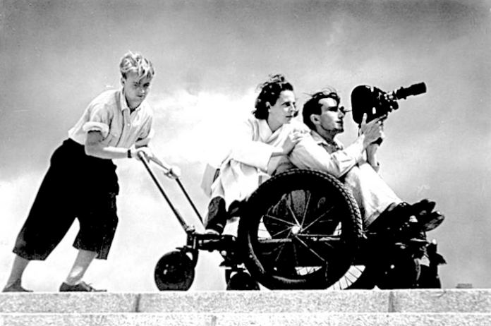 Leni Riefenstahl pictured filming with two assistants in 1936