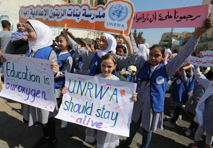 Palestinian students rally in front of the Gaza City headquarters