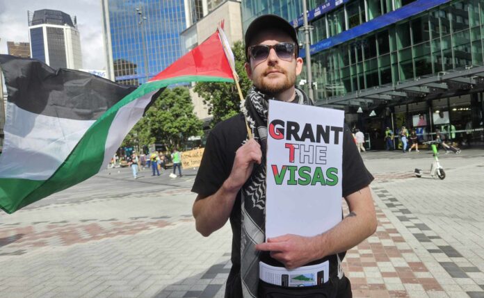 A protester in Auckland's Te Komititanga Square