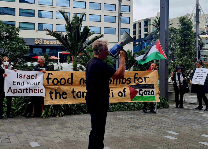 PSNA spokesperson Neil Scott reports to the pro-Palestine picket outside the MFAT Auckland