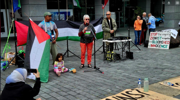 Speakers at today’s Palestine solidarity rally in Takutai Square in Auckland