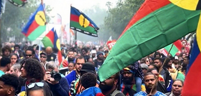 Pro-Kanak protesters at a rally at the Place de la Bastille in Paris