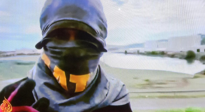 A masked Kanak protester near Nouméa