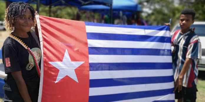 West Papuans in Port Moresby proudly display their Morning Star flag of independence