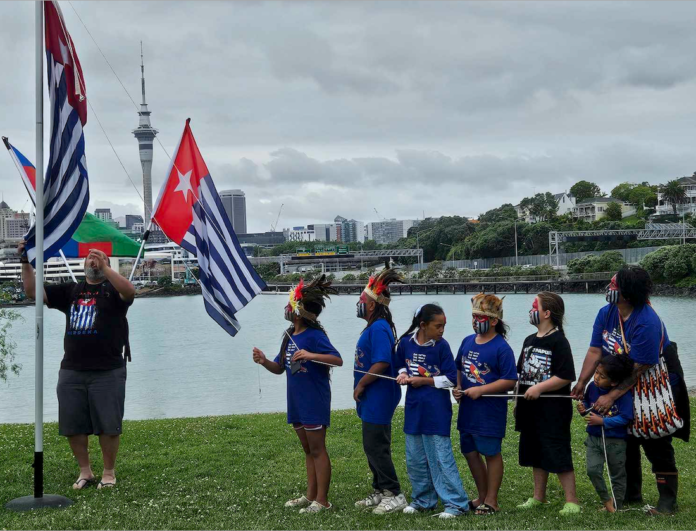 Tamariki raising the West Papuan independence flag Morning Star