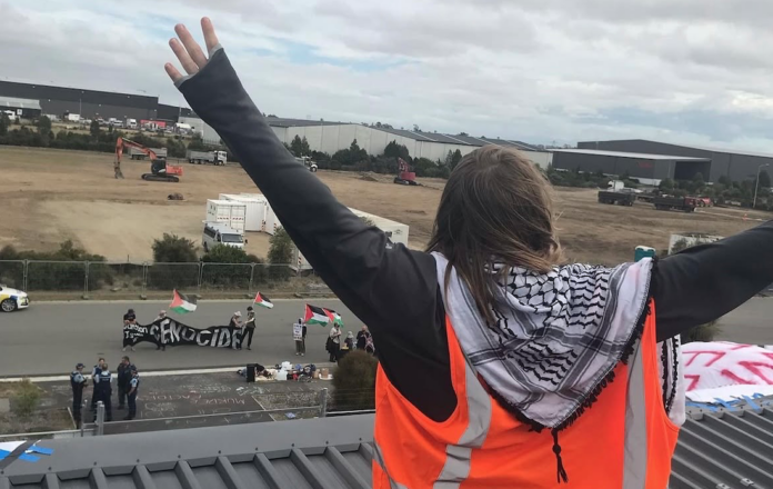 New Zealand protesters who scaled a Christchurch arms company building yesterday accuse it of supplying sniper scopes implicated in Israel's genocidal war against Gaza