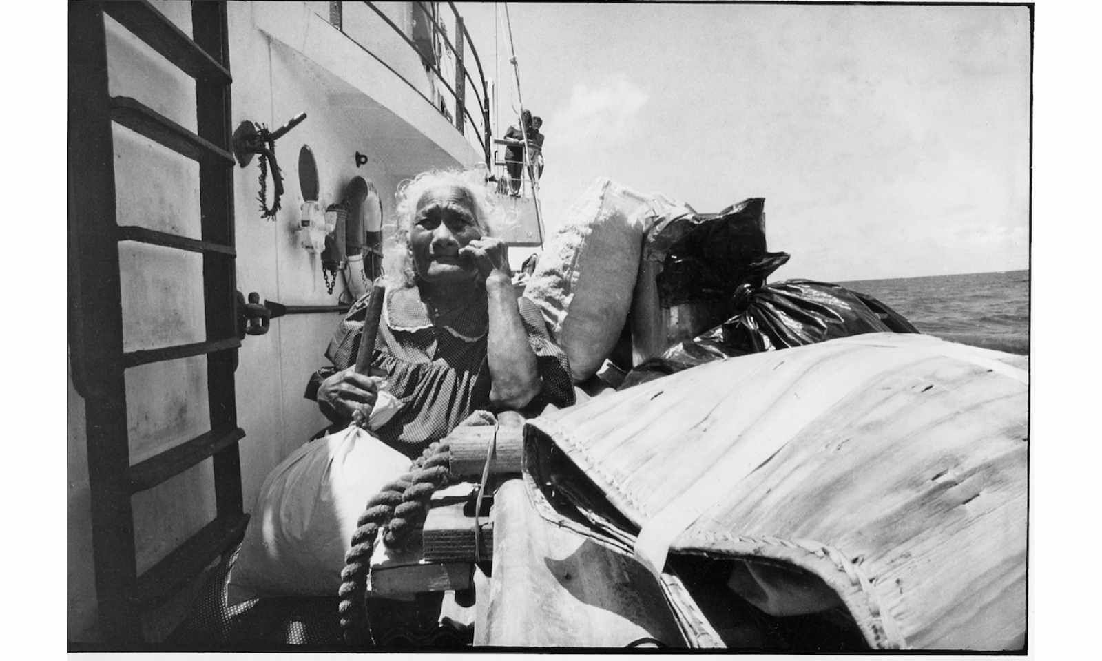 One of the elderly Rongelap Islanders with her home and possessions on the deck of the Rainbow Warrior in May 1985