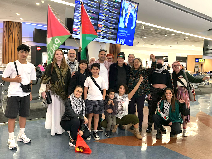 Artist and Palestinian freedom campaigner Rana Hamida - with her arm raised - welcomed by Kia Ora Gaza freedom flotilla supporters at Auckland International Airport