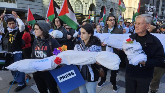 New Zealand pro-Palestine protesters in Auckland carry mock 