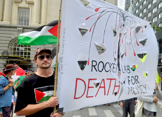 A "Rocket Lab = death for money" banner