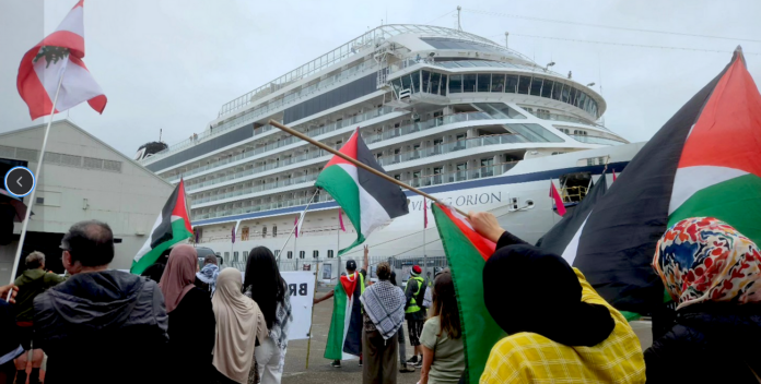 Gaza and Rocket Lab protesters on Auckland Tāmaki Makaurau's Queens Wharf today