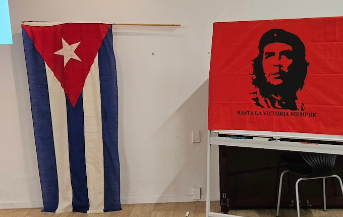 The Cuban flag and an iconic image of Ernesto “Che” Guevara, an Argentine Marxist revolutionary and guerrilla leader who played a key role in the Cuban Revolution at a solidarity meeting in Auckland last night