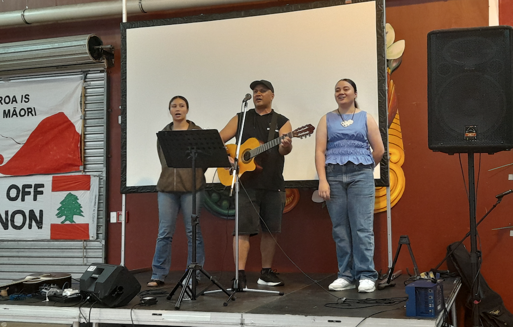 Simon with his daughters singing in Te Reo