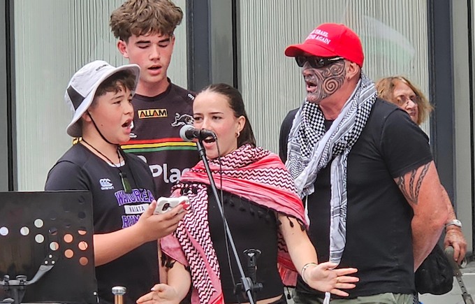 Hahona Ormsby (red cap) and the Ormsby solidarity singers at a Palestinian solidarity rally in Auckland Tāmaki Makaurau on March 28 as he was farewelled before flying to join the Global Sumud Flotilla