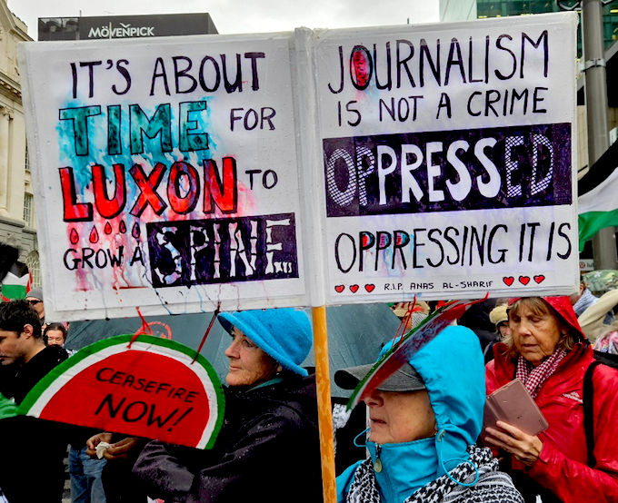 A demonstration placard in Auckland against Prime Minister Christopher Luxon’s stance over Palestine