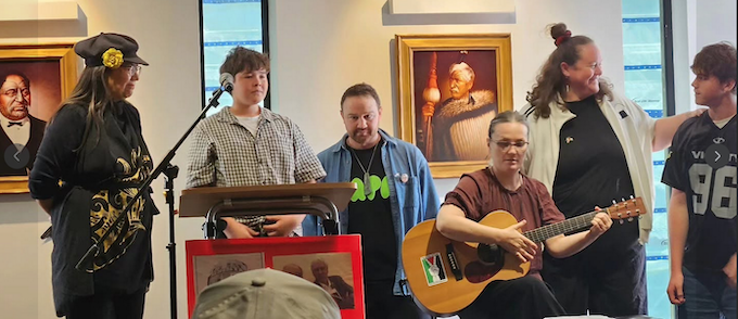 The Roger Fowler whānau singers prepare to share a song at the book launch